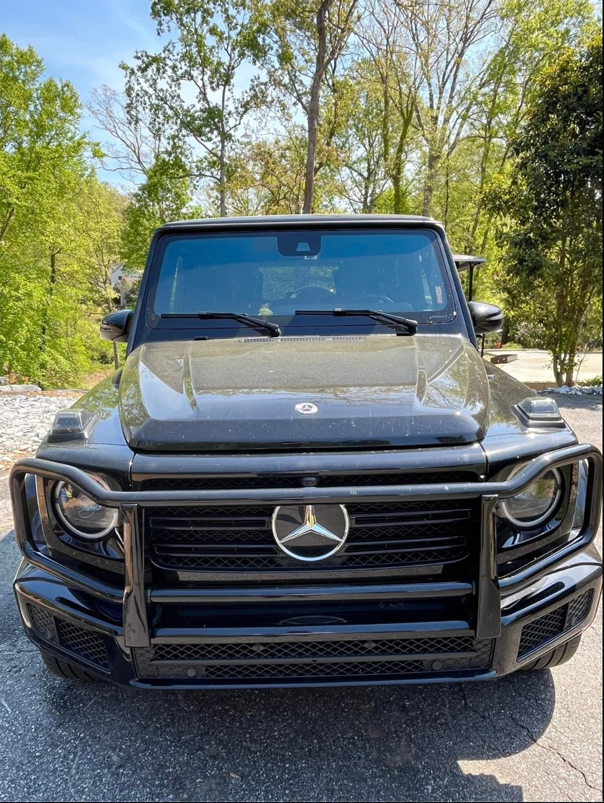 Front-on view of a vehicle with clear, restored headlights
